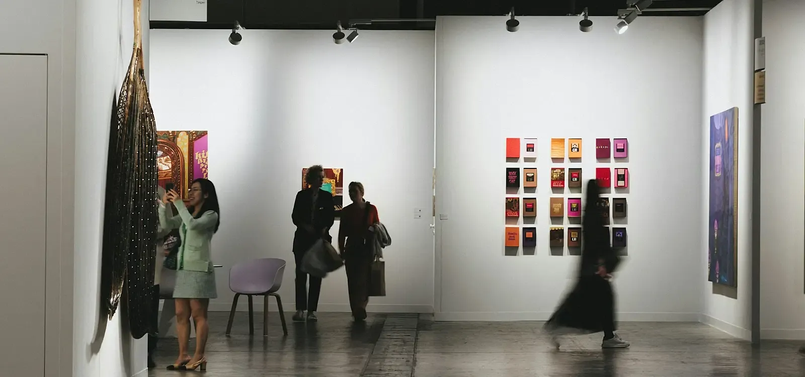 Museum visitors capturing a branded photo with a Simple Booth photo booth