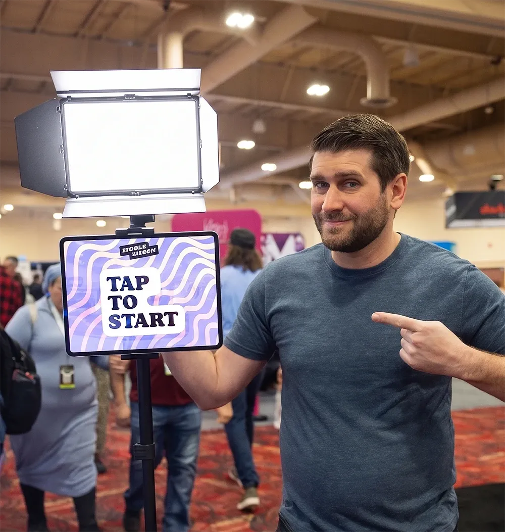 Staff member using Simple Booth roaming photo booth on a tablet at an event