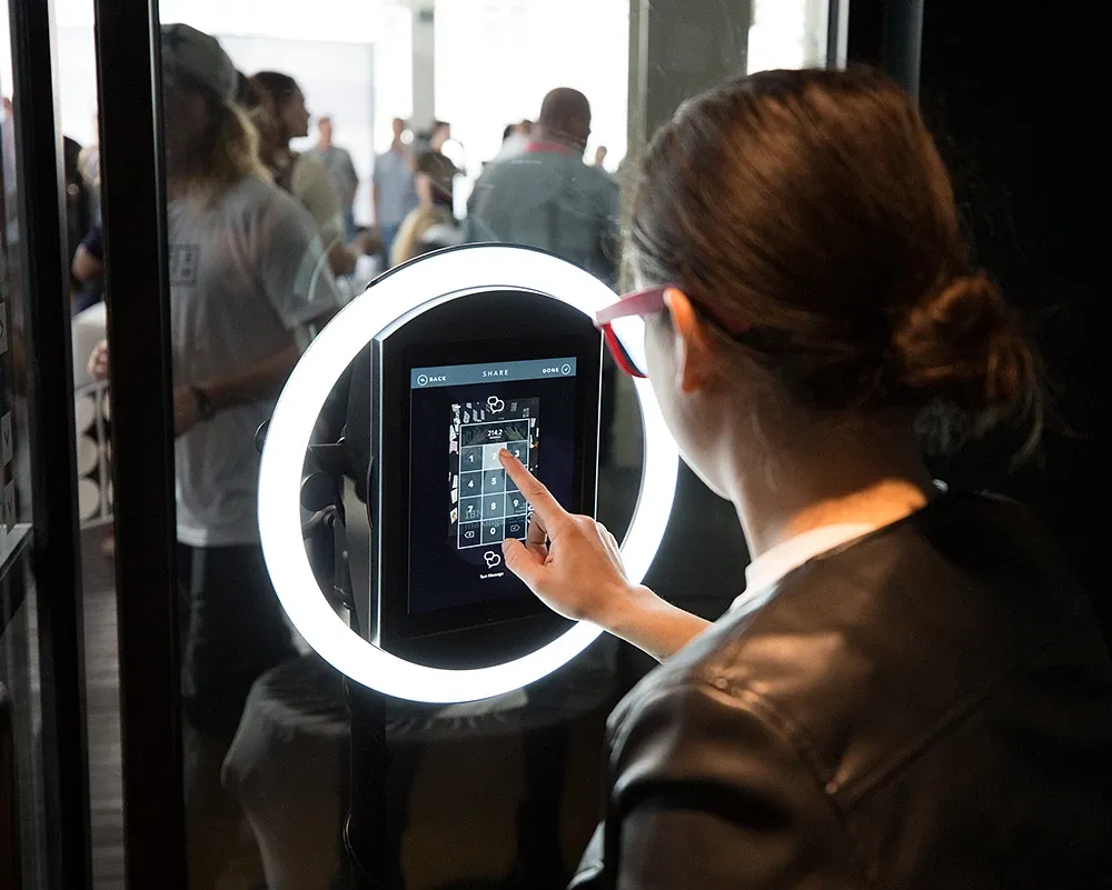 Students using a Simple Booth photo booth at a college campus event
