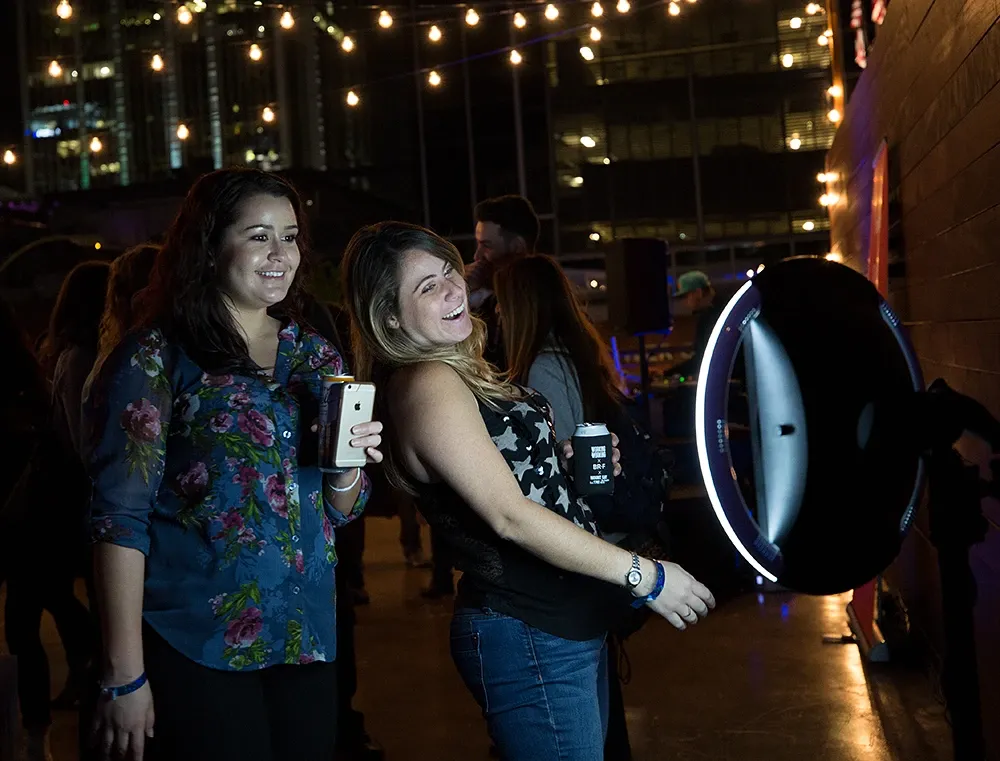 Guests using a Simple Booth photo booth at an event space or venue
