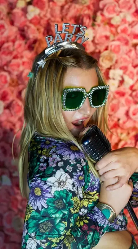 Guests using a photo booth at a venue